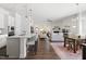 Open floorplan featuring a modern kitchen, dining area, and a living room with fireplace at 330 Middleton Pl, Chapel Hill, NC 27516