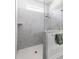 Walk-in shower with glass partition and seat features tiled walls and updated showerhead at 330 Middleton Pl, Chapel Hill, NC 27516