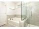 Bright bathroom featuring a tub, separate glass shower, and modern fixtures at 3360 Bordwell Ridge Dr, New Hill, NC 27562