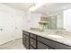 Bathroom with double sinks, granite countertop, and a large mirror at 3360 Bordwell Ridge Dr, New Hill, NC 27562