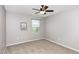 Neutral bedroom with window view, ceiling fan and minimal wall art at 3360 Bordwell Ridge Dr, New Hill, NC 27562