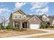 Charming home with a brick and siding exterior, attached garage, and nicely landscaped front yard at 3360 Bordwell Ridge Dr, New Hill, NC 27562
