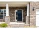 Inviting front porch with brick columns, providing a welcoming entrance to the home at 3360 Bordwell Ridge Dr, New Hill, NC 27562