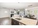Open-concept kitchen with a view of the living area, granite countertops, and modern appliances at 3360 Bordwell Ridge Dr, New Hill, NC 27562