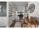 Hallway features stylish decor, wood floors, and ample natural light creating a bright and welcoming entryway at 34 Tea Olive Ct, Clayton, NC 27520