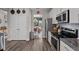 Modern kitchen showcases stainless steel appliances, white cabinets, and a seamless transition to the dining area at 34 Tea Olive Ct, Clayton, NC 27520