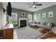 Comfortable living room with fireplace, plush seating, and stylish decor at 34 Tea Olive Ct, Clayton, NC 27520