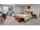 Comfortable bedroom with natural light, featuring carpet floors and an assortment of decorations at 34 Tea Olive Ct, Clayton, NC 27520