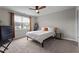 Well-lit bedroom with a comfortable bed, a dresser, and plenty of natural light, perfect for relaxation at 34 Tea Olive Ct, Clayton, NC 27520