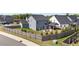Back of a charming blue two-story home featuring a spacious yard with patio and well-kept landscaping at 34 Tea Olive Ct, Clayton, NC 27520