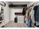 Spacious walk-in closet with ample shelving and hanging space for organized storage at 34 Tea Olive Ct, Clayton, NC 27520