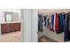 Bathroom with dual sinks and a walk-in closet filled with clothes at 356 Avery Glenn Way, Fuquay Varina, NC 27526