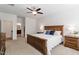 Inviting bedroom with hardwood furniture and large windows with natural light at 356 Avery Glenn Way, Fuquay Varina, NC 27526