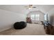 Upstairs bonus room with carpet, a beanbag chair, TV, and an abundance of natural light at 356 Avery Glenn Way, Fuquay Varina, NC 27526