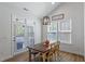 Cozy dining area with wooden table and natural light featuring an exit to a porch at 356 Avery Glenn Way, Fuquay Varina, NC 27526