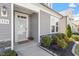 Charming home entrance with decorative door and welcoming landscaping at 356 Avery Glenn Way, Fuquay Varina, NC 27526
