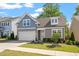 Charming two-story home featuring a two-car garage, manicured lawn, and tasteful landscaping at 356 Avery Glenn Way, Fuquay Varina, NC 27526