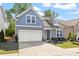 Charming two-story home featuring a two-car garage, manicured lawn, and tasteful landscaping at 356 Avery Glenn Way, Fuquay Varina, NC 27526