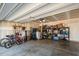 Organized garage space featuring storage shelves, tools, and bicycles at 356 Avery Glenn Way, Fuquay Varina, NC 27526