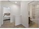 Hallway with a view of a bedroom and bathroom, highlighting the home's layout at 356 Avery Glenn Way, Fuquay Varina, NC 27526