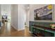 Inviting hallway with wood floors, stylish decor, and a view of the living area at 356 Avery Glenn Way, Fuquay Varina, NC 27526