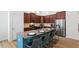 Modern kitchen features stainless steel appliances, granite counters, and a breakfast bar with seating at 356 Avery Glenn Way, Fuquay Varina, NC 27526