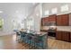 Open concept kitchen with modern appliances, large island and pendant lights at 356 Avery Glenn Way, Fuquay Varina, NC 27526