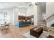 Open concept with living room, dining area, and kitchen with island seating at 356 Avery Glenn Way, Fuquay Varina, NC 27526