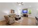 Bright open living room with fireplace, TV, and comfortable seating at 356 Avery Glenn Way, Fuquay Varina, NC 27526