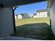 Spacious backyard showing the lawn, and neighboring houses at 37 Heatherglenn Cir, Princeton, NC 27569