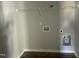 Utility room with vinyl flooring and washing machine hookups ready to be set up at 37 Heatherglenn Cir, Princeton, NC 27569