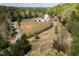 Aerial view of horse property with a home, barn, fencing and trees at 3787 Pleasant Hill Church, Siler City, NC 27344