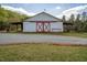 Barn with crossbuck sliding doors and a gravel driveway at 3787 Pleasant Hill Church, Siler City, NC 27344