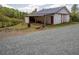 Barn with gravel and a small grassy area, as well as fencing at 3787 Pleasant Hill Church, Siler City, NC 27344