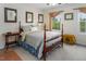 Bedroom with decorous windows and a decorative bed dressed with a plush blue blanket at 3787 Pleasant Hill Church, Siler City, NC 27344