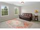 Comfortable bedroom with two large windows and futon, flooded with natural light at 3787 Pleasant Hill Church, Siler City, NC 27344