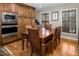 Traditional dining room featuring a wood table with seating for six and custom wood cabinets and windows with wooden shutters at 3787 Pleasant Hill Church, Siler City, NC 27344