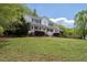 Charming two-story home with a welcoming front porch, set on a beautifully landscaped lawn at 3787 Pleasant Hill Church, Siler City, NC 27344