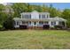 Inviting two-story home with a covered front porch, black shutters, and well-manicured landscaping at 3787 Pleasant Hill Church, Siler City, NC 27344