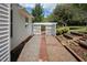 Side yard pathway with raised garden beds, offering a tranquil outdoor space for gardening enthusiasts at 3787 Pleasant Hill Church, Siler City, NC 27344