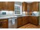 Modern kitchen with custom cabinets, granite countertops, stainless steel appliances, and stone backsplash at 3787 Pleasant Hill Church, Siler City, NC 27344