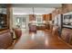 Spacious kitchen featuring custom wood cabinets, granite counters, stainless appliances, and an island with seating at 3787 Pleasant Hill Church, Siler City, NC 27344