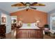 Bedroom featuring a vaulted ceiling, warm lighting, with views to other parts of the home at 3787 Pleasant Hill Church, Siler City, NC 27344