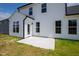 Backyard with a new concrete patio and exterior view of the home at 40 Rosewood Ln, Youngsville, NC 27596