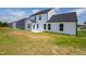Backyard with new construction and green space behind a white home at 40 Rosewood Ln, Youngsville, NC 27596