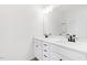 Bright, clean bathroom with double sink vanity, quartz countertop, dark faucet and a large mirror at 40 Rosewood Ln, Youngsville, NC 27596