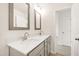 Bathroom with double sinks, white countertops and decorative mirrors at 40 Rosewood Ln, Youngsville, NC 27596