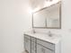 Bright bathroom with a double vanity, modern fixtures, and a large mirror at 40 Rosewood Ln, Youngsville, NC 27596