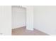 Bedroom with neutral carpet, white walls, and a doorway to a closet at 40 Rosewood Ln, Youngsville, NC 27596