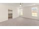 Bright bedroom with carpet, natural light, and a walk-in closet at 40 Rosewood Ln, Youngsville, NC 27596
